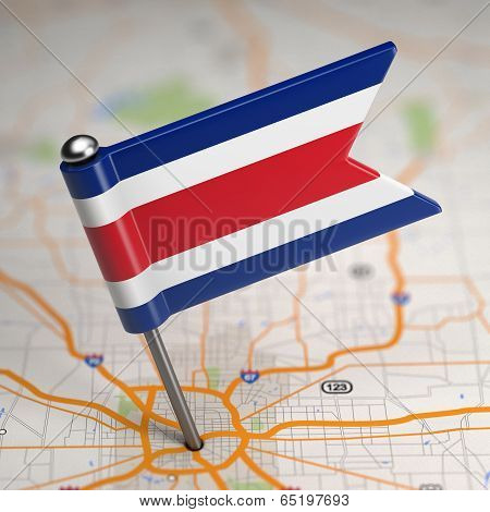 Costa Rica Small Flag on a Map Background.