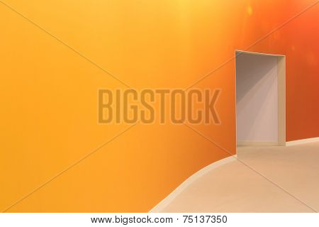 Orange Wall And Open Entrance In A Empty Room