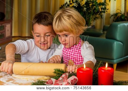 children baking cookies for christmas. cookies for the christmas season