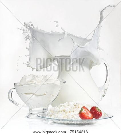 Still-life with cottage cheese both fresh sour cream and a strawberry