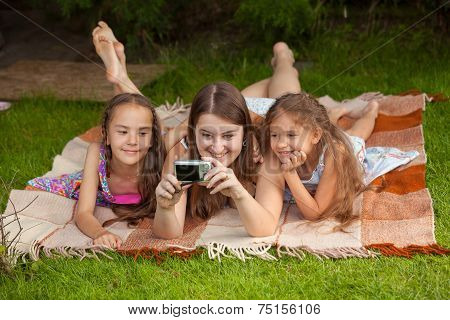 Mother And Two Daughters Making Self Photo