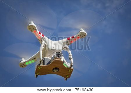 FORT COLLINS, CO, USA, November 1, 2014:  Airborne radio controlled Phantom 2 quadcopter drone flying  with the Panasonic Lumix GM1 camera mounted on a home made platform.