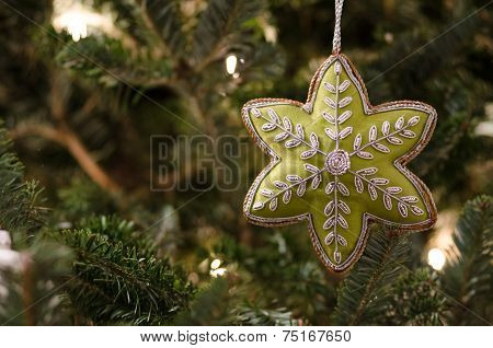 Star Ornament On Christmas Tree
