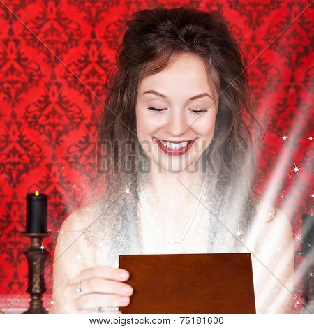 Smiling Girl In Evening Dress Opening A Gift Wooden Box In Vintage Interior
