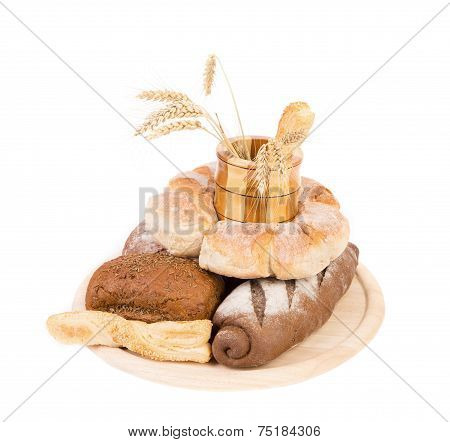 Different breads. Jar and tray of wood. Ears.