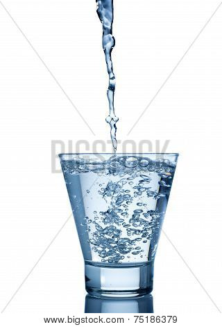 water splash in glass isolated on white