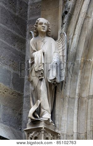 VIENNA, AUSTRIA - OCTOBER 11: Angel, facade of Minoriten kirche in Vienna, Austria on October 11, 2014.