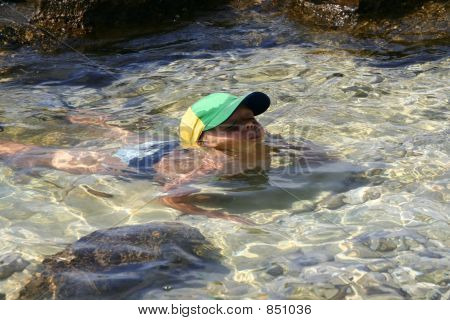 Boy Playing In The Water