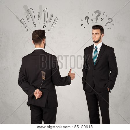 Ruthless businessman handshake with drawn exclamation and question marks around them head