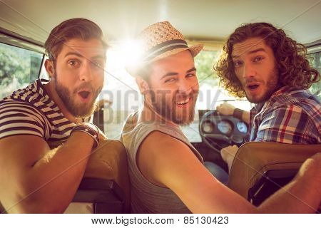 Hipster friends on road trip on a summers day
