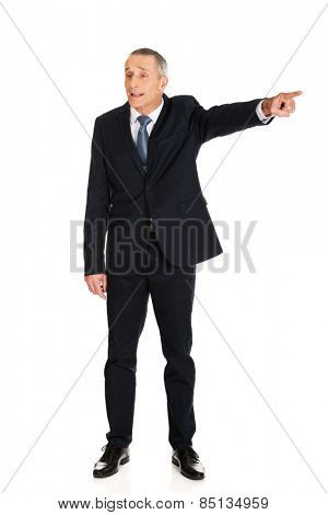 Full length boss dismissing someone.