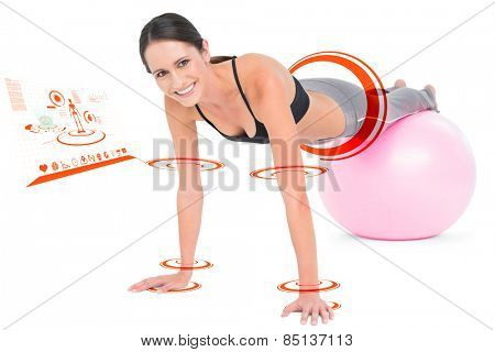 Fit woman doing push ups on fitness ball against fitness interface