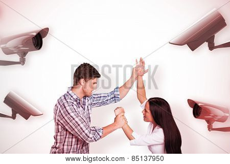 Aggressive man overpowering his girlfriend against cctv camera