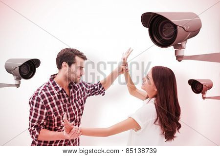 Fearful brunette being overpowered by boyfriend against cctv camera