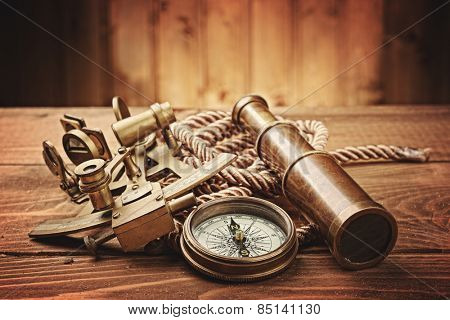 vintage  still life with compass,sextant and spyglass 