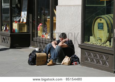 Homeless man at Madison Square in Midtown Manhattan
