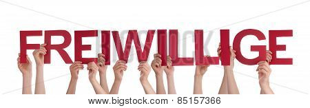 People Holding Red Straight German Word Freiwillige Means Volunteer