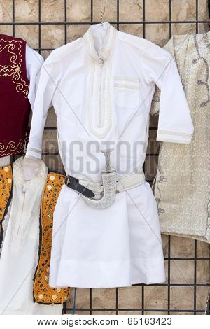 DOHA, QATAR - MARCH 8, 2015: Traditional Qatari children's tunics on sale in Souq Waqif.