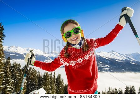 Winter vacation, snow, skier - girl enjoying winter