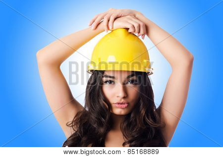 Young woman with hellow hard hat 