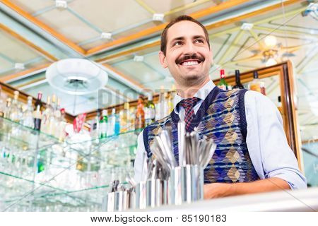 Barista preparing coffee in cafe bar using professional espresso machine