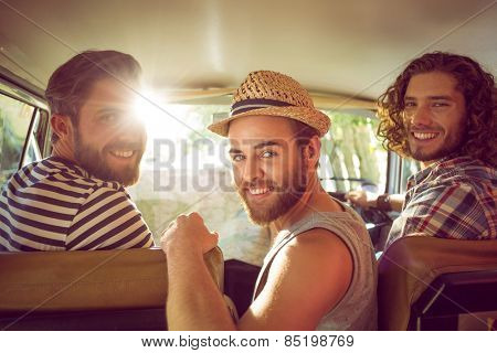 Hipster friends on road trip on a summers day