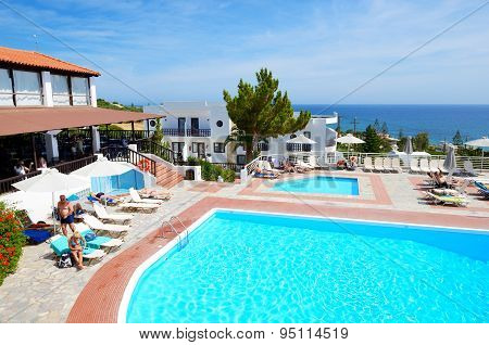 Crete, Greece - May 12: The Tourists Enjoiying Their Vacation On The Beach On May 12, 2014 In Crete,