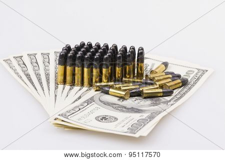 ammunition from the gun on 100 dollar bills