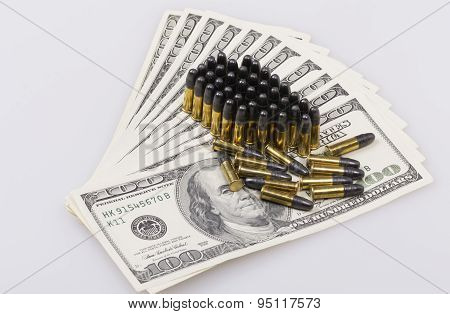 ammunition from the gun on 100 dollar bills