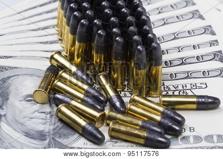 ammunition from the gun on 100 dollar bills