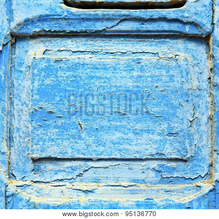 Stripped Paint In The Blue Wood Door And Rusty Nail