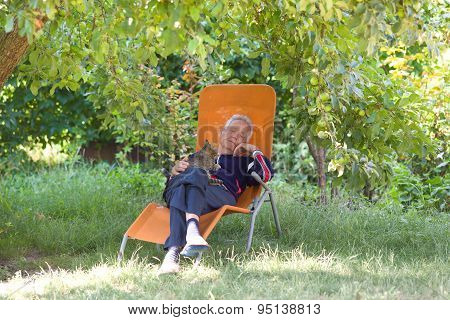 Senior Man With Cat In Garden