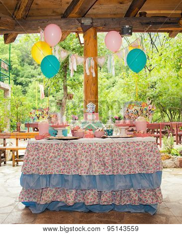Prepared birthday table with sweets for children party
