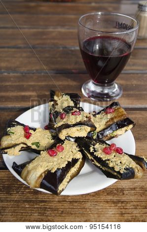 Eggplant phvali and a glass of wine. Georgian cuisine