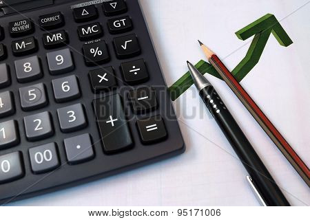 Eye Glasses, pen and pencil over the Formula with calculator