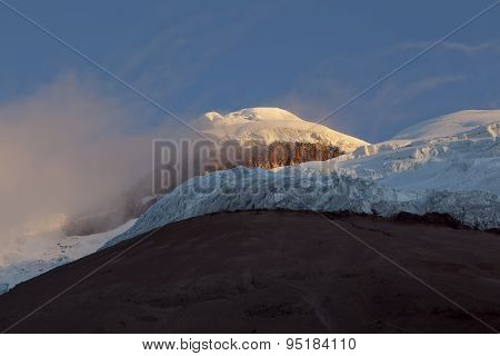 Summit And Yanasacha Rock Wall In The Cotopaxi Volcano At Dusk