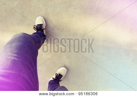 closeup of relax skateboarder legs stand on ramp