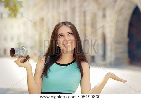 Undecided Girl with Compact Digital Camera