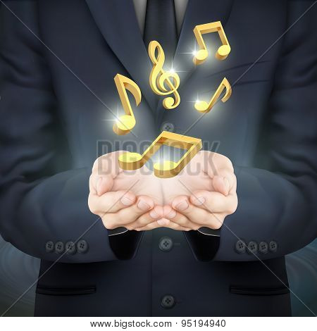 Businessman Holding Golden Music Notes
