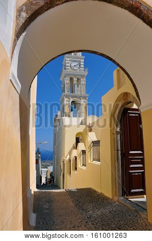 The bell tower of catholic cathedral situated in the capital town of fira on santorini island greece.