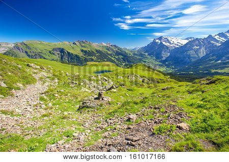 Panorama view to Grindelwald from Mannlichen with Eiger Monch and Jungfrau mountain (Swiss Alps) in the background Berner Oberland Grindelwald Switzerland.