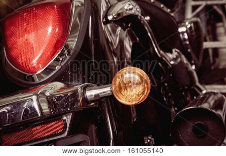 Old and dirty motorcycle tail lights (tail lamp or rear lights) with selective focus and vintage effect