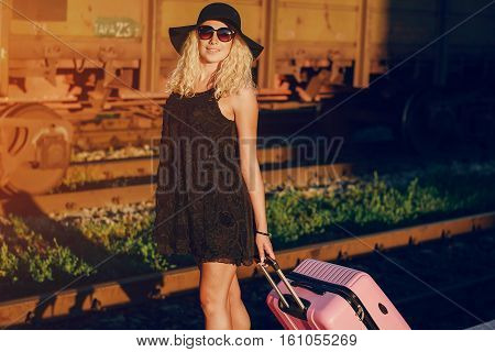 beautiful girl at raiway station. uses communication