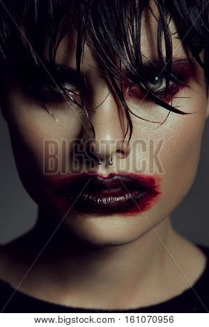 Fashion portrait of man jn a dark background
