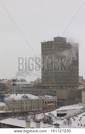 KAZAN, RUSSIA - DECEMBER 11, 2016: Kazan Federal University, faculty of physics. Cloudy winter snow day vertical