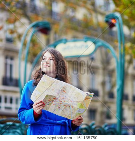 Beautiful Tourist In Paris On A Fall Day, Using Map