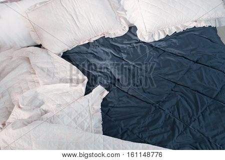 Rumpled bed after sleeping top view, free space. Messy bed, hotel room, nightmare, bedroom, bed dream, rest concept