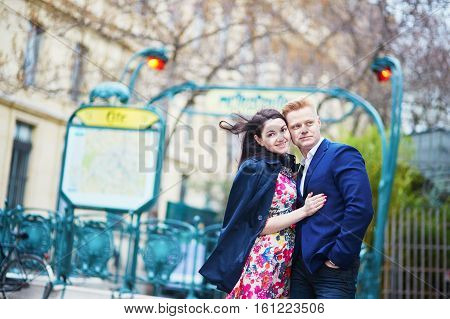 Romantic Couple In Paris Near Metro Station