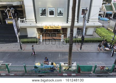 BANGKOKTHAILAND - NOV 26 : life of garland seller near Erawan shrine at Ratchaprasong Junction in morning on november 26 2016. Erawan shrine is famously sacred place in bangkok