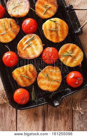 Grilled Potato Halves And Tomatoes With Herbs On The Grill. Vertical Top View